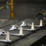 Deco-Products | Zinc Manufacturing | How Zinc is a Good Corrosion Resistant Metal | Zinc Parts on Conveyer Belt