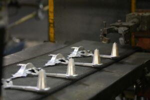 Deco-Products | Zinc Manufacturing | How Zinc is a Good Corrosion Resistant Metal | Zinc Parts on Conveyer Belt